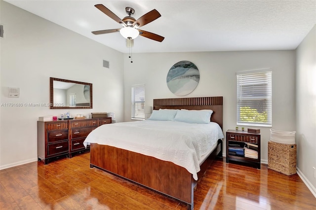 5133 N Springs Way, Coral Springs, FL 33076 - bedroom with a ceiling fan, baseboards, visible vents, and wood finished floors
