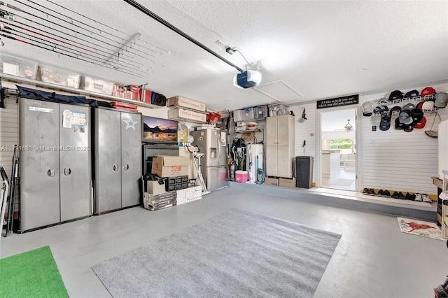 5133 N Springs Way, Coral Springs, FL 33076 - garage featuring a garage door opener and water heater