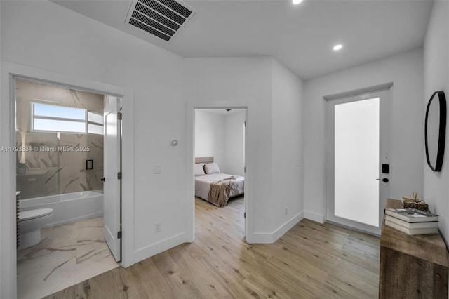 932 Alcalde St E, Lehigh Acres, FL 33974 - entrance foyer featuring visible vents, recessed lighting, baseboards, and light wood finished floors