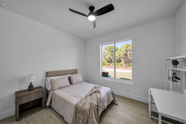 932 Alcalde St E, Lehigh Acres, FL 33974 - bedroom with light wood-type flooring, baseboards, and ceiling fan