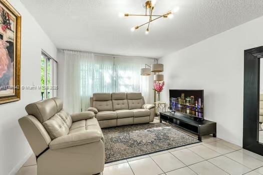 15430 SW 82nd Ln Unit 625, Miami, FL 33193 - living room with tile patterned flooring and a notable chandelier