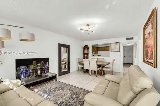 15430 SW 82nd Ln Unit 625, Miami, FL 33193 - living room with a chandelier, tile patterned flooring, and visible vents