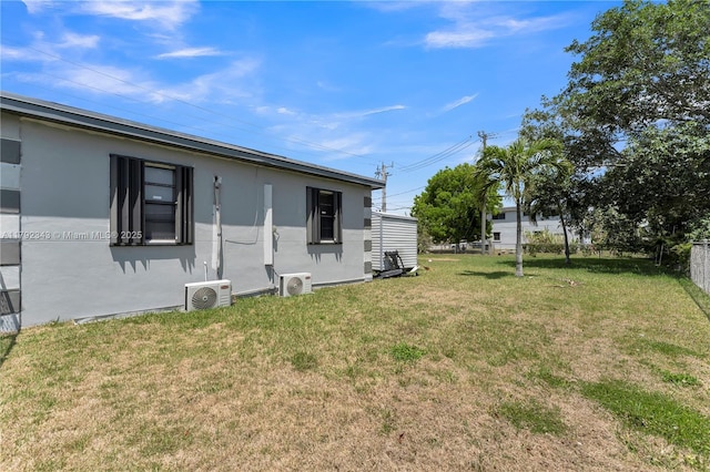 exterior space featuring ac unit and fence