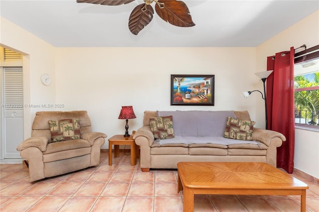 living area featuring a ceiling fan and light tile patterned floors