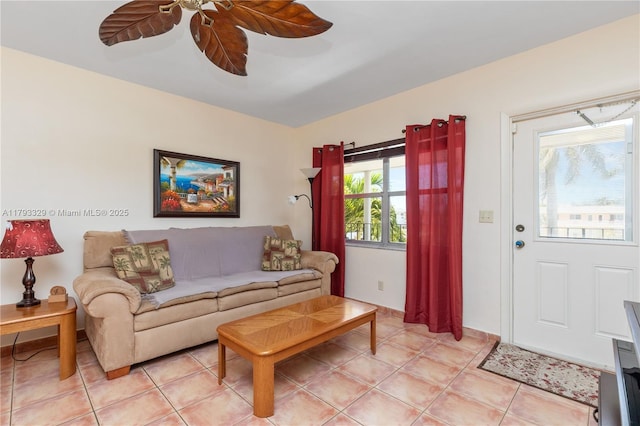 living room featuring ceiling fan and light tile patterned floors
