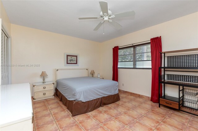 bedroom with light tile patterned floors