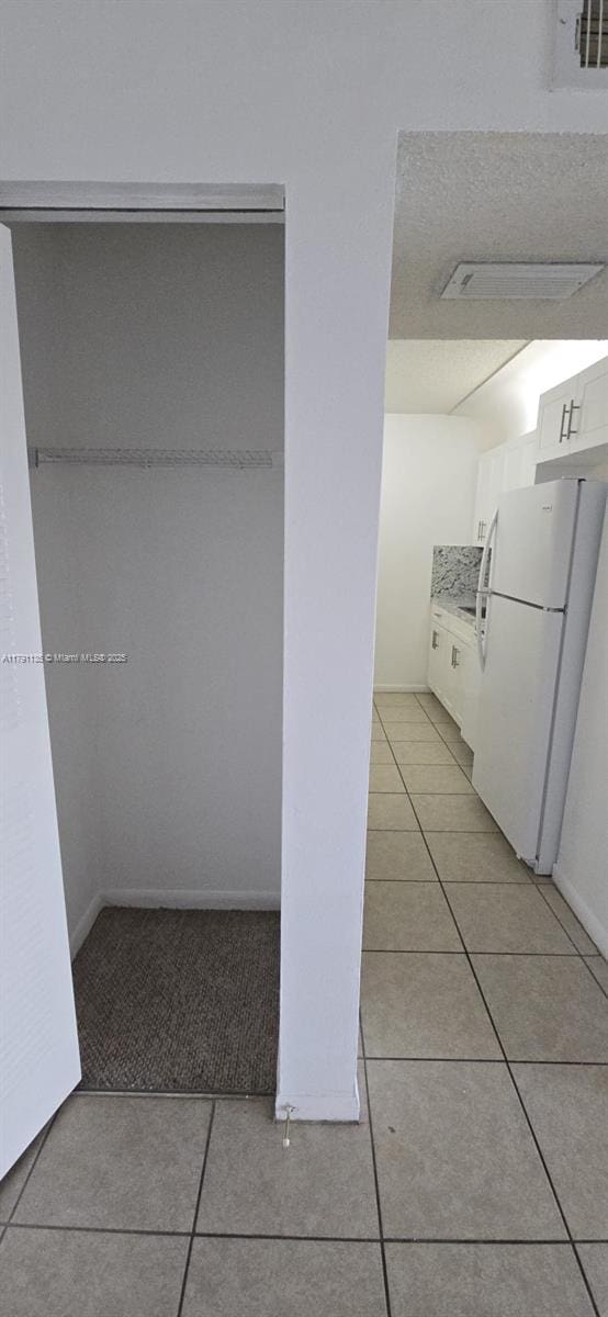 8240 SW 210th St Unit 214, Cutler Bay, FL 33189 - hallway featuring light tile patterned flooring