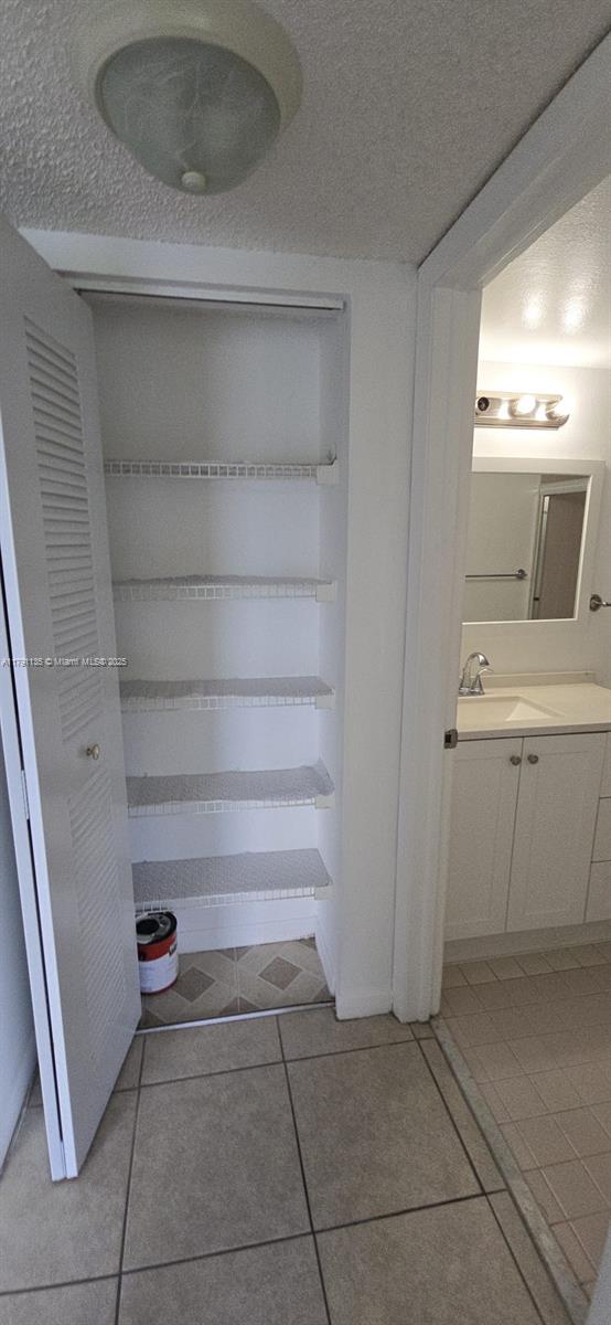 8240 SW 210th St Unit 214, Cutler Bay, FL 33189 - closet featuring a sink