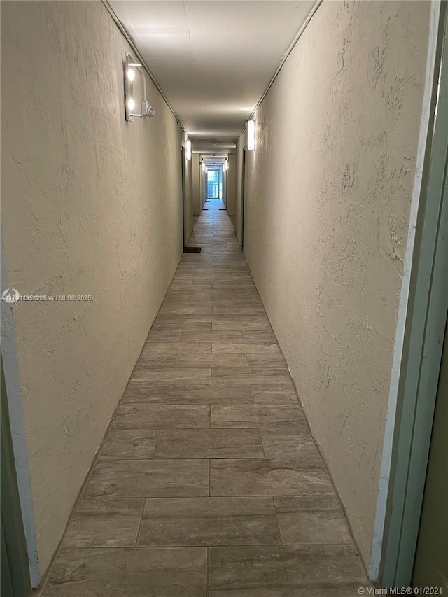 8240 SW 210th St Unit 214, Cutler Bay, FL 33189 - corridor with a textured wall and light wood finished floors