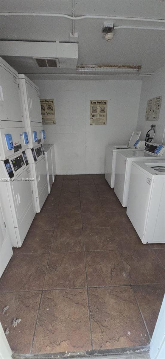 8240 SW 210th St Unit 214, Cutler Bay, FL 33189 - communal laundry room featuring stacked washing machine and dryer and washing machine and dryer