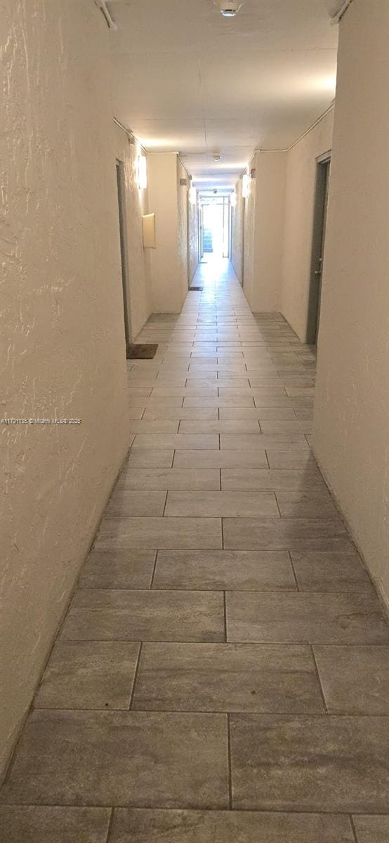 8240 SW 210th St Unit 214, Cutler Bay, FL 33189 - hallway with wood finish floors