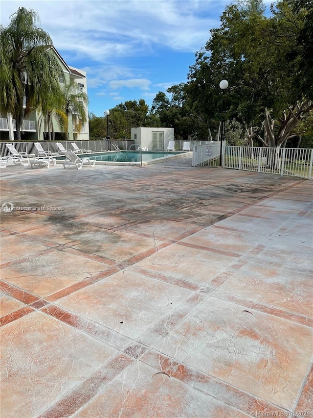 8240 SW 210th St Unit 214, Cutler Bay, FL 33189 - pool featuring a patio and fence
