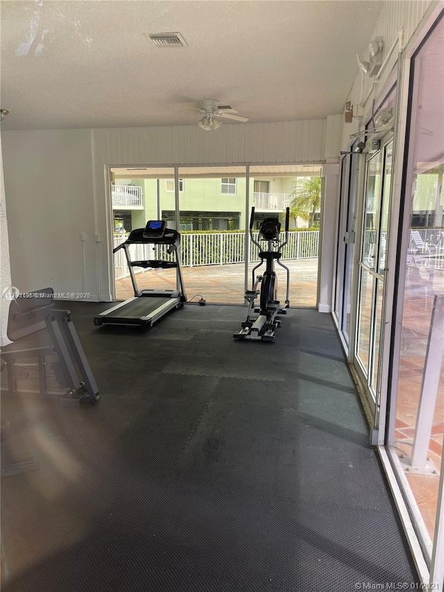 8240 SW 210th St Unit 214, Cutler Bay, FL 33189 - workout area with ceiling fan, visible vents, and plenty of natural light