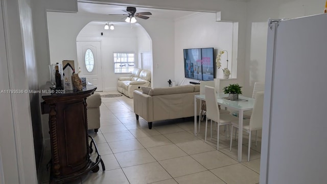 248 SW 18th Ct, Miami, FL 33135 - living area with arched walkways, ceiling fan, ornamental molding, and light tile patterned flooring