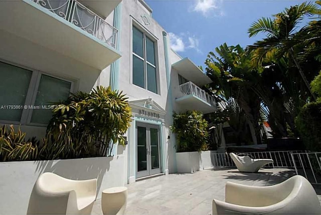 1751 James Ave Unit 101, Miami Beach, FL 33139 - view of patio / terrace featuring french doors and a balcony