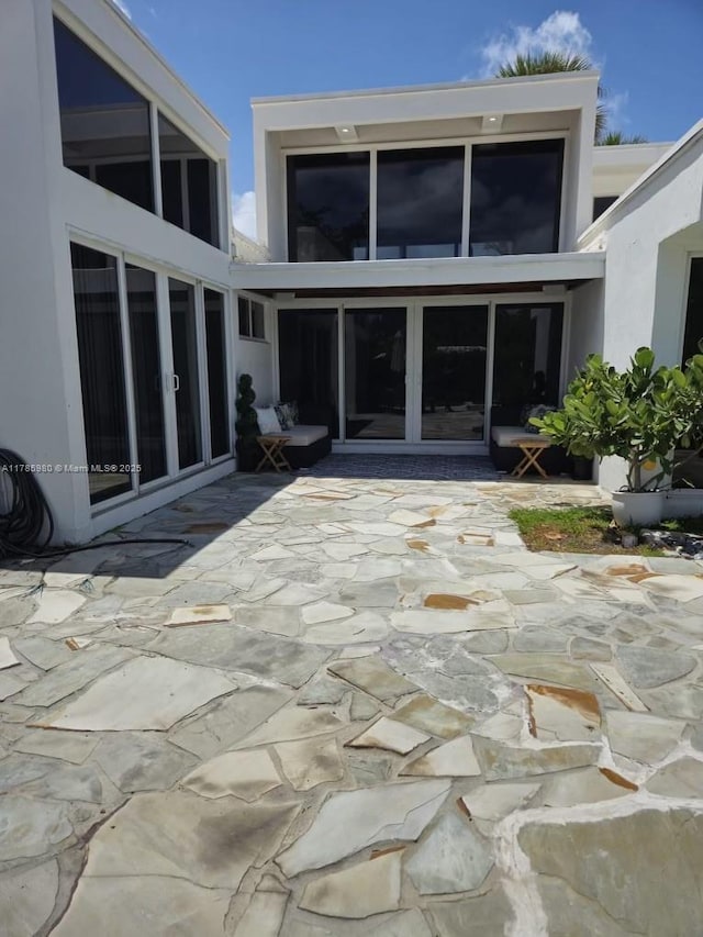 4050 NE 25th Ave, Lighthouse Point, FL 33064 - rear view of property featuring a patio and stucco siding