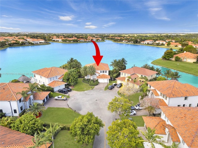 aerial view featuring a water view and a residential view