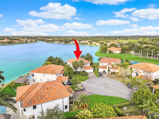 aerial view with a water view and a residential view