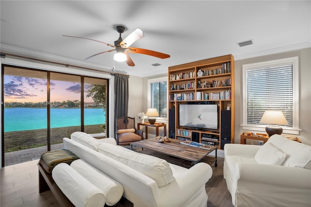 living room featuring ornamental molding, ceiling fan, and wood finished floors