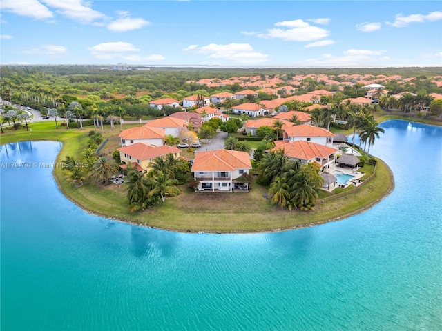 birds eye view of property featuring a water view and a residential view