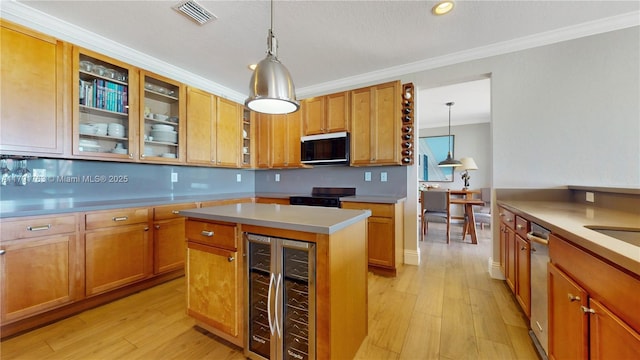 kitchen featuring light wood-style floors, black electric range, wine cooler, visible vents, and ornamental molding
