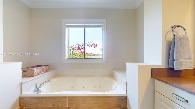 full bathroom with crown molding and a tub with jets