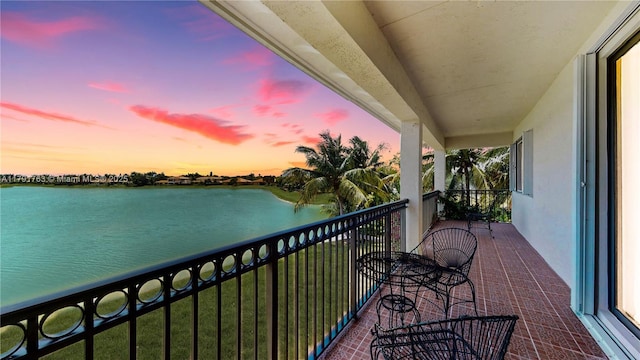 balcony at dusk with a water view