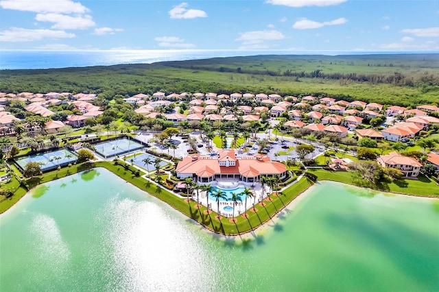 birds eye view of property with a water view and a residential view