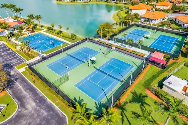 birds eye view of property with a water view
