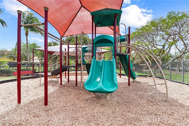 communal playground featuring fence