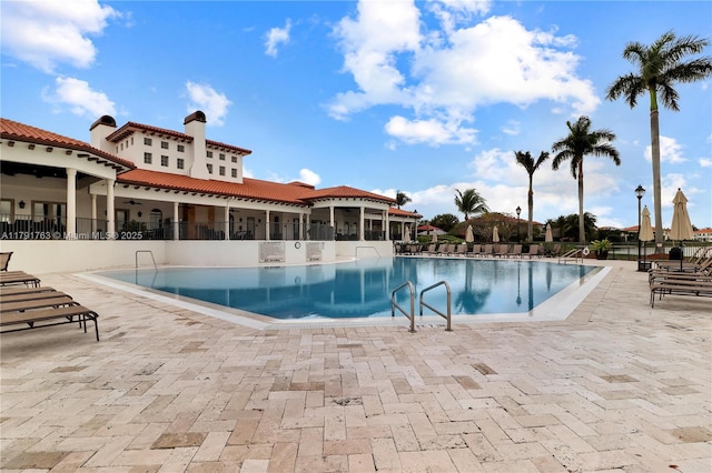 community pool with a patio area