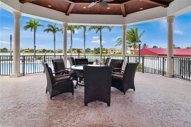 view of patio with ceiling fan, a fenced in pool, and outdoor dining space