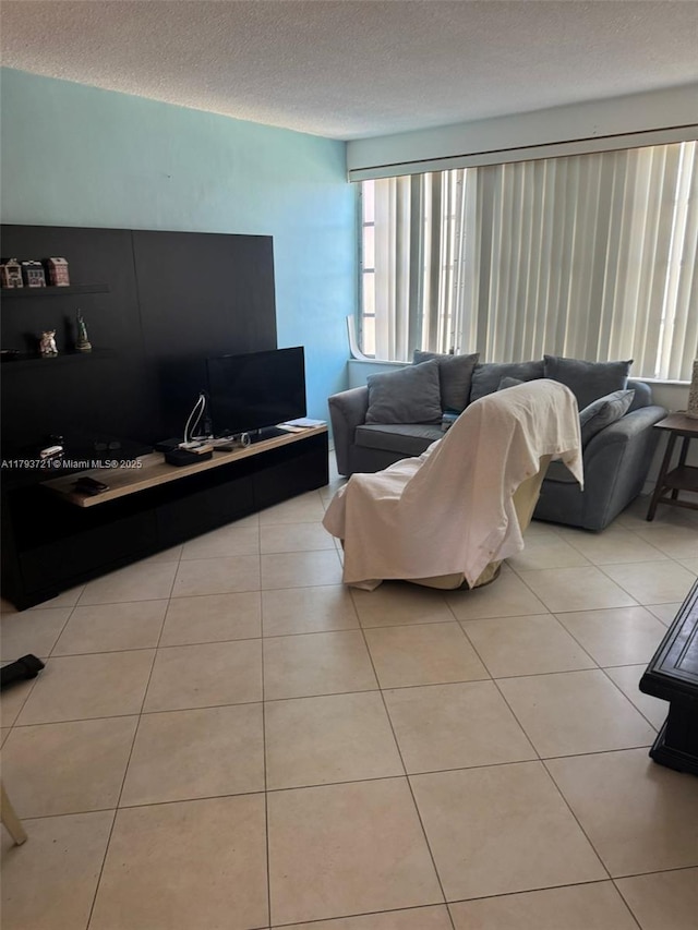 18555 NE 14th Ave Unit 602, Miami, FL 33179 - living room featuring a textured ceiling and light tile patterned floors