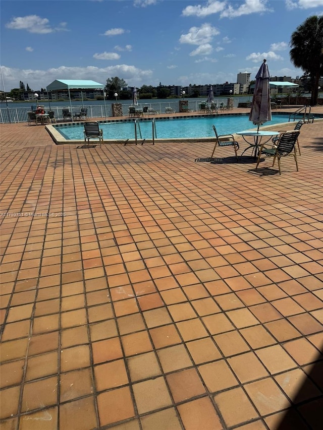 18555 NE 14th Ave Unit 602, Miami, FL 33179 - view of swimming pool featuring fence