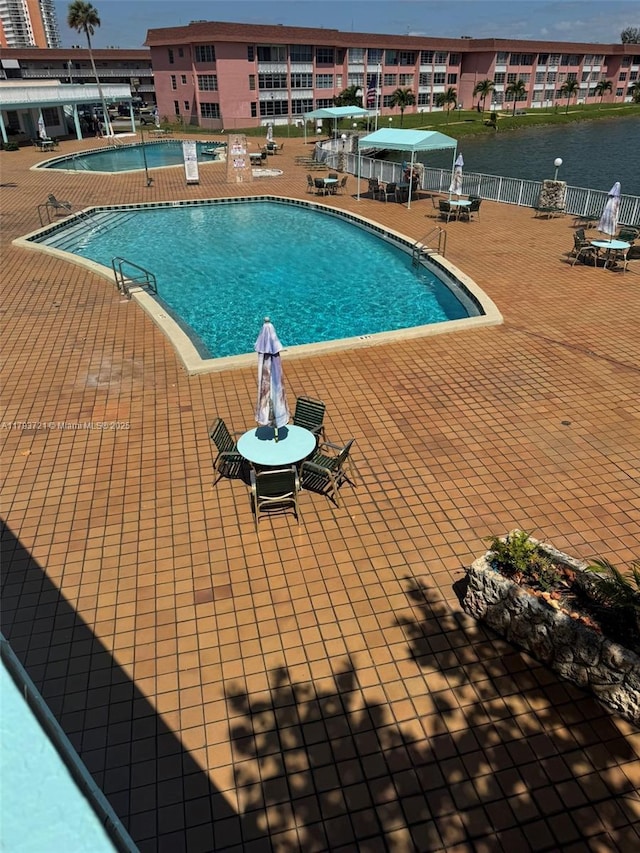 18555 NE 14th Ave Unit 602, Miami, FL 33179 - community pool with fence and a patio area