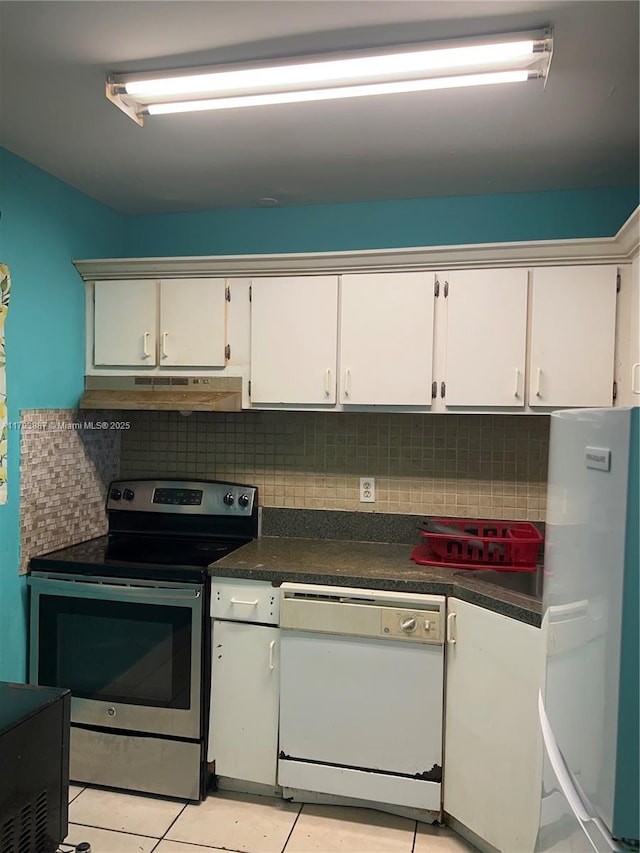 kitchen with decorative backsplash, dark countertops, white appliances, white cabinetry, and under cabinet range hood