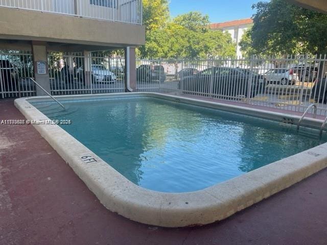 community pool with fence