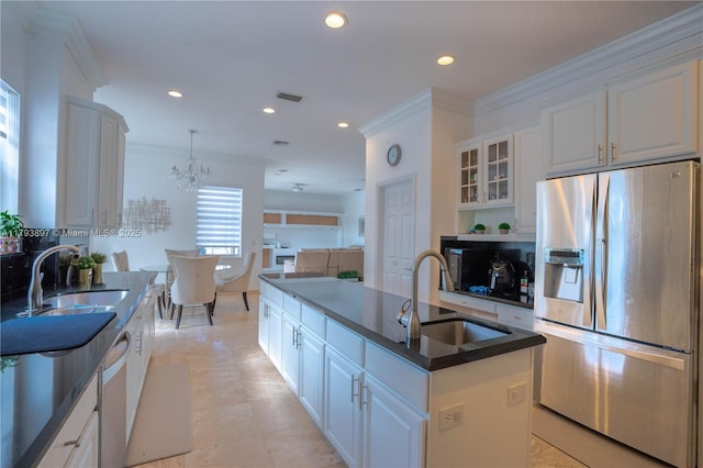 15852 SW 15th St, Davie, FL 33326 - kitchen featuring stainless steel appliances, ornamental molding, a center island with sink, and a sink