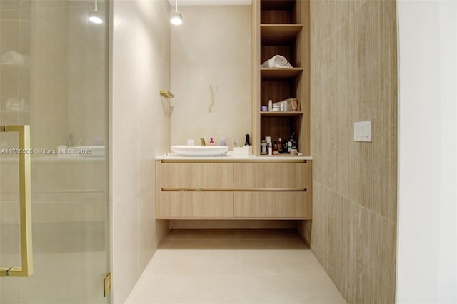 bathroom with vanity, built in features, tile patterned flooring, and a stall shower