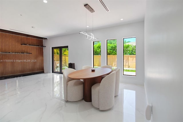 dining room featuring recessed lighting and marble finish floor