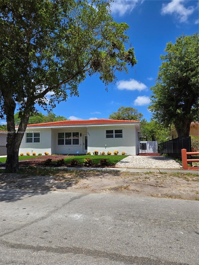 view of front of house featuring fence