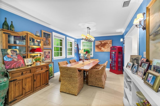dining space featuring crown molding, visible vents, baseboards, light tile patterned floors, and a notable chandelier