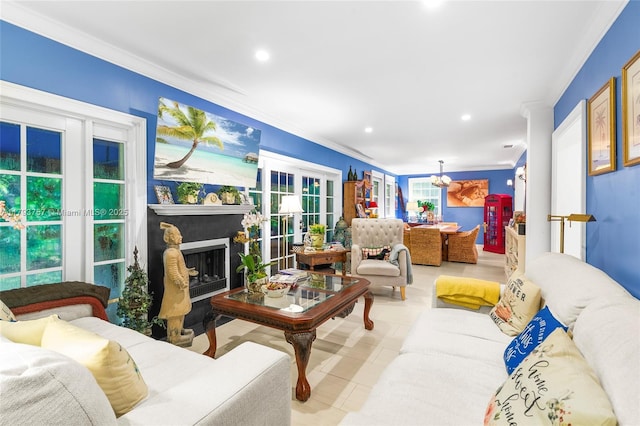 living area featuring crown molding, recessed lighting, french doors, and a fireplace