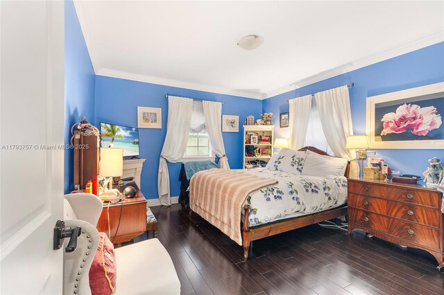 13101 SW 82nd Ave, Pinecrest, FL 33156 - bedroom featuring crown molding, wood finished floors, and baseboards