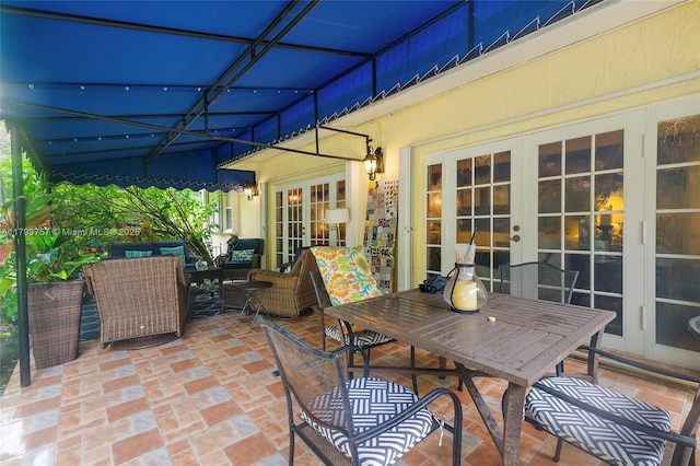 view of patio / terrace featuring an outdoor living space, french doors, and outdoor dining space