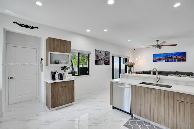kitchen featuring recessed lighting, modern cabinets, a sink, and dishwasher