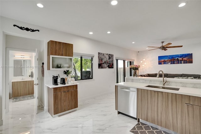 kitchen featuring a sink, modern cabinets, stainless steel dishwasher, and recessed lighting