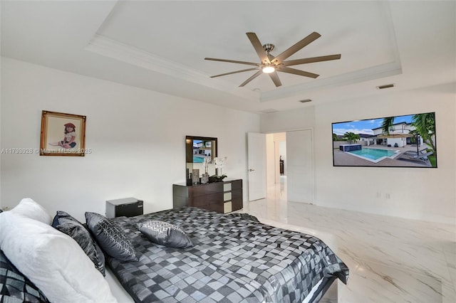 bedroom with crown molding, marble finish floor, visible vents, and a raised ceiling