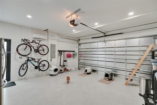 garage with recessed lighting, a garage door opener, a wall unit AC, and electric panel