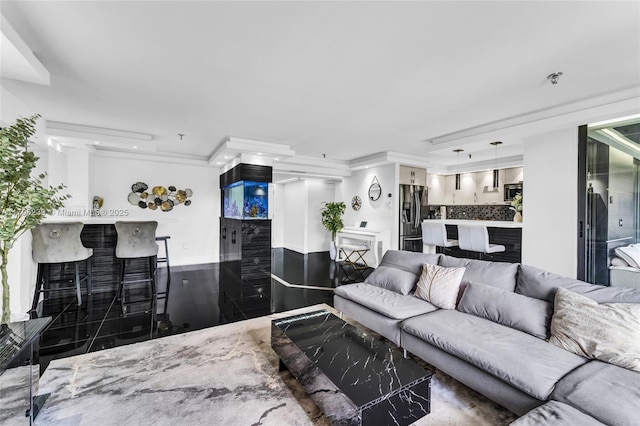 living room featuring baseboards and ornamental molding